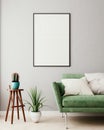 Vertical mock up poster frame in olive green modern interior background, living room, Scandinavian style Royalty Free Stock Photo