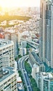 Vertical modern cityscape building bird eye aerial view under sunrise and morning blue bright sky in Tokyo, Japan