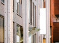 Vertical modern shop signage on modern building wall