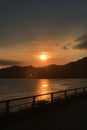 Vertical mountain, cloud, sun and footpath at sunset Royalty Free Stock Photo