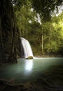 Vertical nature background of tropical waterfall in jungle