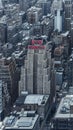 Vertical of the New Yorker neon sign on an art deco skyscraper in midtown Manhattan, United States.