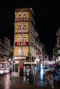 Vertical night picture of streets ad buildings in Porto, Portugal