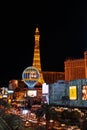 Vertical night shot of the Eiffel Tower in front of the Paris Hotel and Casino in Las Vegas