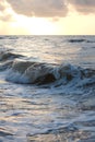 Vertical of ocean waves in Galveston, Texas during sunset