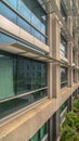 Vertical Office building exterior with close up on the glass windows and concrete wall Royalty Free Stock Photo