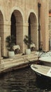 Vertical of an old building with boats on a shore