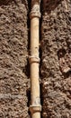 Vertical of the old drain pipe embedded in the wall of the house, Puertollano, Ciudad Real, Spain Royalty Free Stock Photo