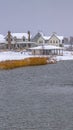 Vertical Oquirrh lake with view of snowy lakefront homes Royalty Free Stock Photo