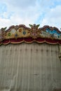 Vertical of an ornate detail of a carousel top in Florence, Italy.