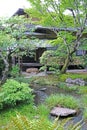 vertical outdoor footpath, green plants and pavilion in the Japanese zen garden Royalty Free Stock Photo