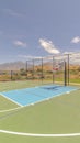 Vertical Outdoor green basketball court three point line