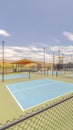 Vertical Outdoor tennis courts and sunny recreational park
