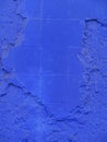 Vertical: Painted blue textured concrete and brick wall. Royalty Free Stock Photo
