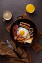 Vertical pan fried english breakfast on wooden background. Traditional american cuisine Royalty Free Stock Photo