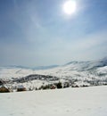 Vertical panorama of idyllic snowy winter landscape in the mountains Royalty Free Stock Photo