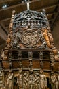 Vertical panorama view of the ornate hand-carved stern of the Vasa warship in the Vasa Museum in Stockholm