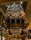 Vertical panorama view of the ornate hand-carved stern of the Vasa warship in the Vasa Museum in Stockholm