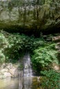 Vertical panorama of waterfall, mountain and river in the tropical jungles in Gunung Mulu National park. Royalty Free Stock Photo