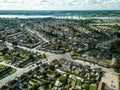 Vertical panoramic aerial view of suburban houses in Ipswich, UK. Orwell bridge and river in the background.