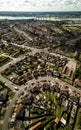 Vertical panoramic aerial view of suburban houses in Ipswich, UK. Orwell bridge and river in the background.