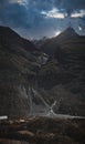 Vertical panoramic of the sun rising behind mountains of India and a small river coming through them Royalty Free Stock Photo