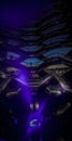 Vertical panoramic view of Hudson Yards vessel with blue spotlight pointing upward.
