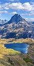Vertical panoramic view at Midi Ossau mountain peak and Lake Gentau from the mountain pass Ayous in Franch Atlantic Pyrenees, as Royalty Free Stock Photo