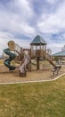 Vertical Park with playground and picnic pavilion overlooking a snow capped mountain