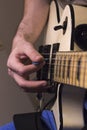 Vertical perspective guitar practice under the dim light Royalty Free Stock Photo