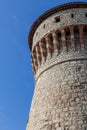 The vertical perspective emphasizes the grandeur of Torre dei Prigionieri, a part of Brescia castle, with its stone masonry Royalty Free Stock Photo