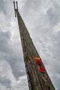 Vertical Perspective Weathered Utility Pole Reflective Markers and Cloudy Sky Royalty Free Stock Photo