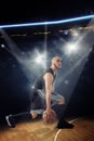 Vertical photo of bald professional basketball player in the game dribbles Royalty Free Stock Photo