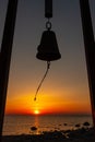 BellÃÂ´s silhouette moving in wind during sunset in sea