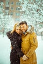 Vertical photo of betrothed couple in love looking at camera and