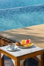 Vertical photo of breakfast at the swimming pool Royalty Free Stock Photo