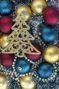 vertical photo with christmas or new year background with red, golden and blue christmas balls, golden beads and Royalty Free Stock Photo