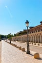 Vertical photo in color of a path around the palatial building, House of the infants of Aranjuez.