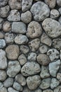 Vertical photograph of a decorative pattern of stones from the sea shore