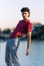 Vertical photo of an effeminate young man with modern look dancing outdoors