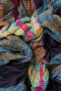 Vertical photo of the fragment of multicolored fabric texture old scarf