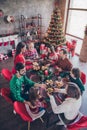 Vertical photo friendly family having festive christmas dinner on winter holidays indoors apartment