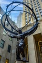 Vertical photo of the giant Atlas holding the planet earth as punishment of the gods, in the fifth avenue of the big apple. It is