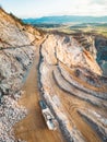 Vertical photo of gravel roads on the side of the open pit quarry Royalty Free Stock Photo