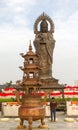 Vertical photo of Guanying Buddha statue at Guiyuan Buddhist Temple in Wuhan Hubei China