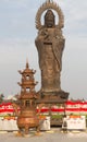 Vertical photo of Guanying Buddha statue at Guiyuan Buddhist Temple in Wuhan Hubei China