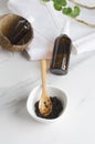 Vertical photo of homemade coffee scrub and coconut oil for hair, body care treatments at spa salon. Royalty Free Stock Photo