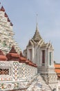 Detail of intricate ceramic wall with chedi and sky as background in Wat Arun. Bangkok, Thailand.