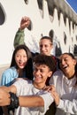 Vertical photo of a Latin guy taking a selfie with a multiracial group of people. Happy students together on Royalty Free Stock Photo