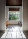 Light bathroom interior with ceramic sink on wooden table, modern decor, built bathtub